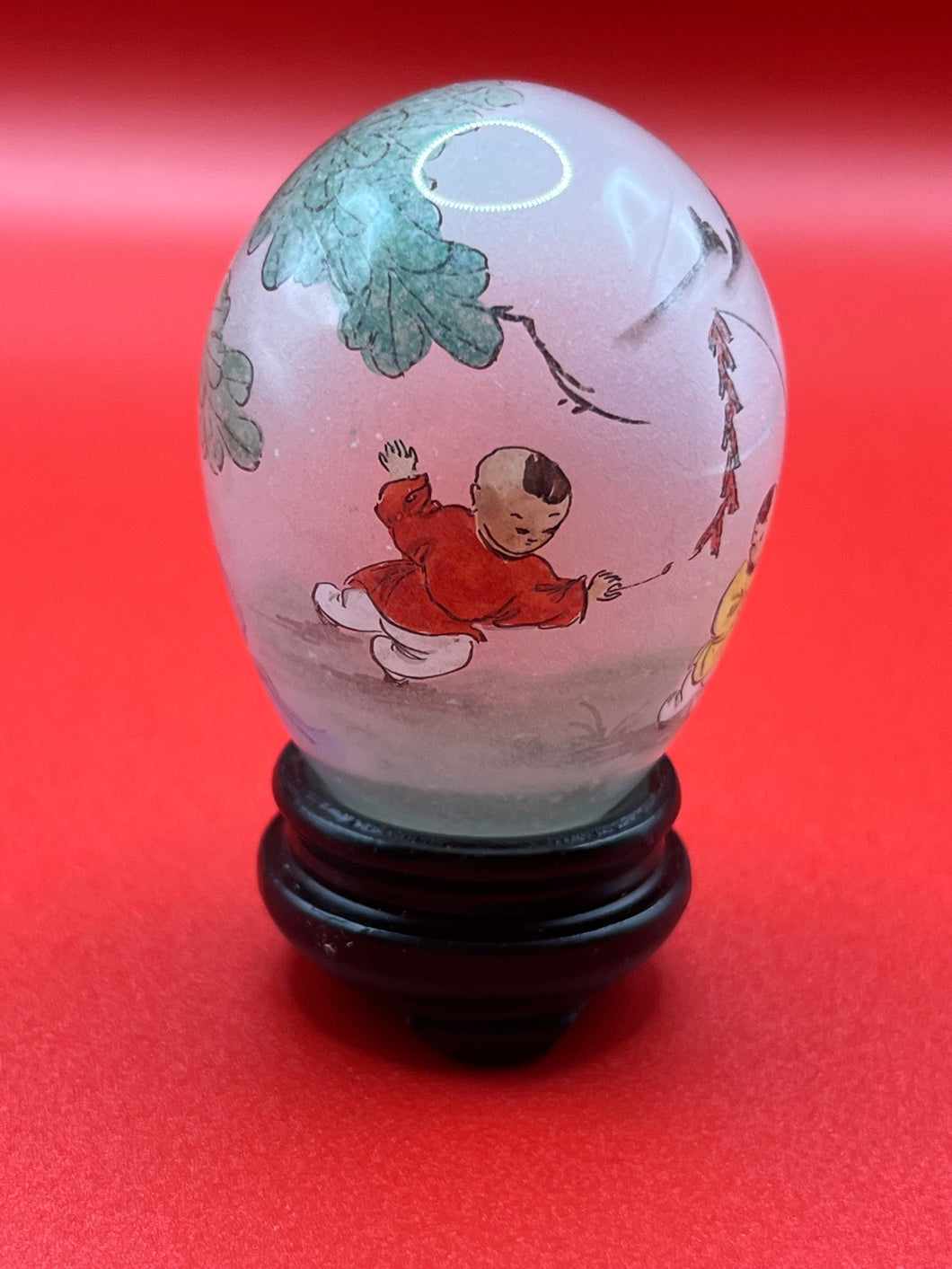 Hand painted glass egg with stand